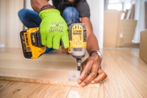 HAVS image example: Close-up of person's hands, holding a drill.